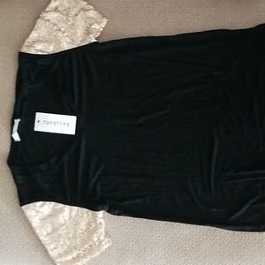 Black top with gold sequence on both sleeves.  NEW